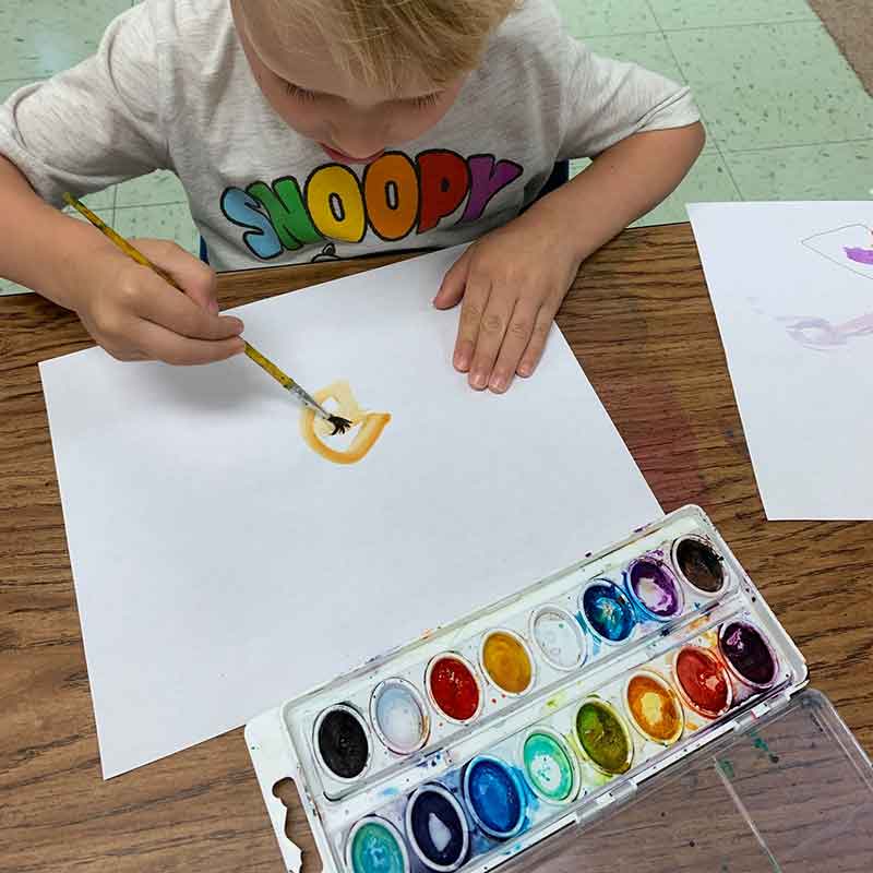 Child painting | Birch Mountain Day School, Inc.